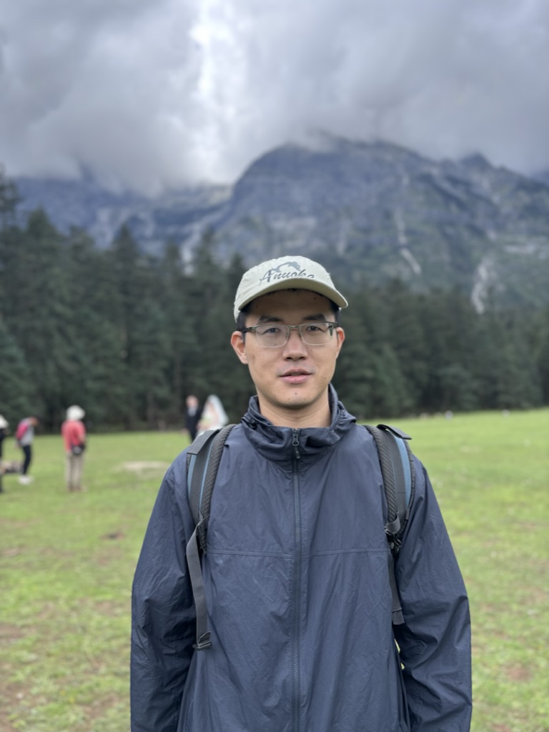 Siyuan Cheng in front of mountains